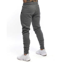 Pantalones deportivos para hombre tejido técnico estilo ajustado - Finn